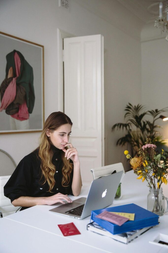 Woman at Laptop With Flowers