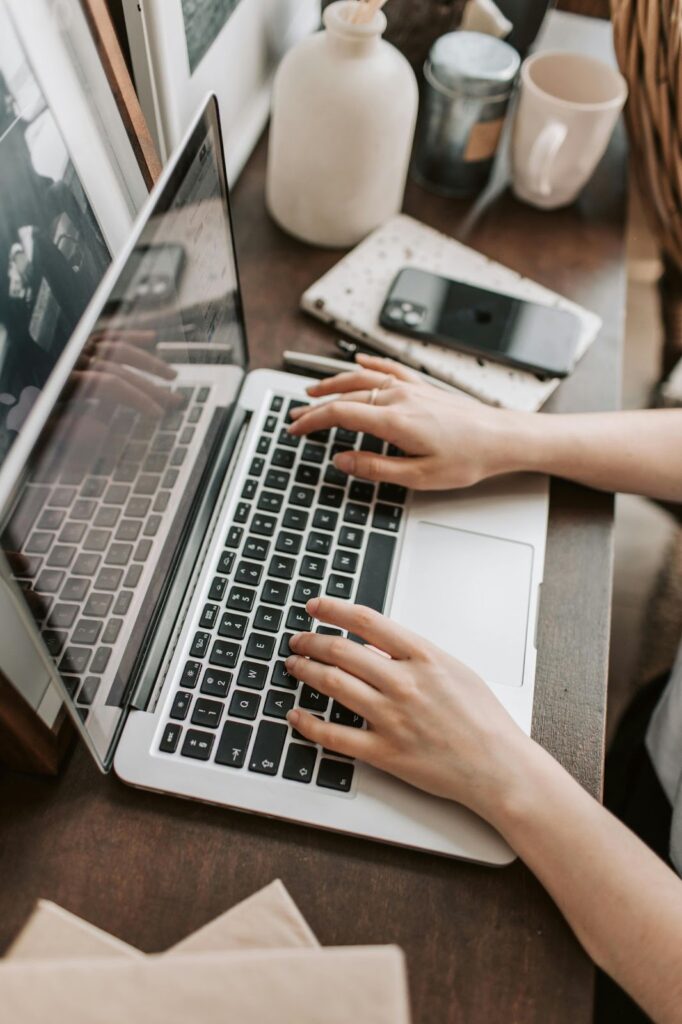 Person Typing on a Laptop