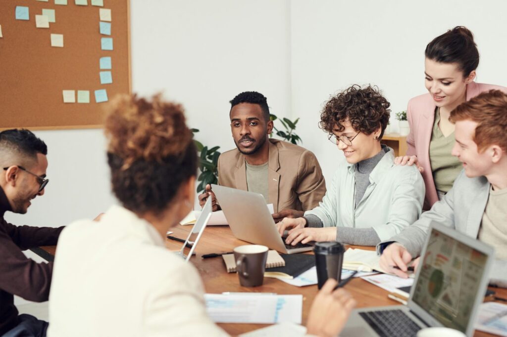 A diverse team of employees engaged in a discussion about accountability